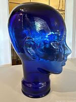 Right side profile of cobalt blue glass mannequin head