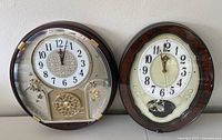 Both clocks side by side showing overall design and condition