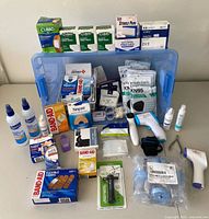 Overview of entire lot in blue bin with all first-aid items displayed