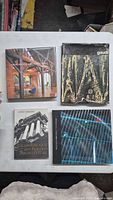 Four architecture books laid out on table