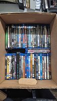 Overview of open box showing two rows of Blu-ray cases