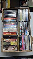 Full top view of two rows of DVDs in box