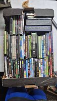 Overall view of open box showing quantity and arrangement of DVDs