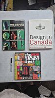Front covers of all three design books on table