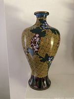 Front view of cloisonné vase showing floral decoration and overall shape