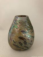 Front view of iridescent pear-shaped bud vase