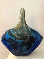 Front view showing vase form and blue-green coloration