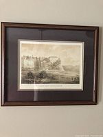 Full view of framed lithograph on wall