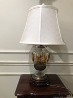 Full view of lamp with shade on side table