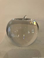 Front view of clear crystal apple paperweight showing full shape and stem
