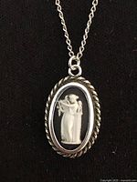 Front view of pendant showing cameo and sterling bezel