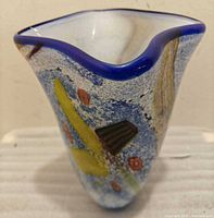 Front angle showing abstract design and blue rim
