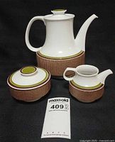 Front view of entire three-piece Thomas Arcta set with coffee pot, creamer and sugar bowl