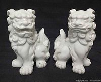 Front view of the two porcelain foo dogs