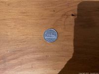 Reverse side showing beaver design and 1938 date