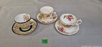 Three teacups each on its matching saucer displayed top view