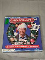Front of game box featuring Chevy Chase with Christmas wreath design