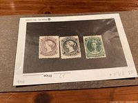 Three Nova Scotia mint stamps (#8, #9, #11) on backing paper