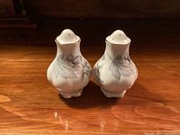 Front view of both Royal Albert Silver Maple shakers