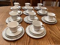 Entire 44-piece place setting groups arranged on table