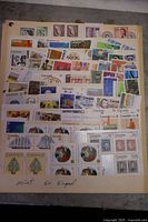 Full view of one stock sheet showing assorted Canadian stamps and handwritten note 'mint no hinged'