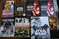 All eight books laid out showing front covers