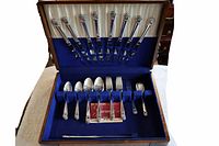 Open chest showing entire flatware set and chest