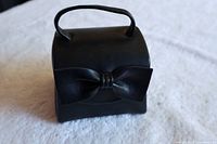 front view showing leather box, handle and bow