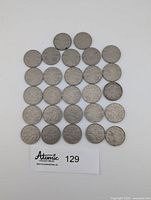 All 27 coins laid out front side visible