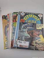 Stack of eight horror comics with Ghost Castle on top