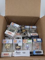 Box of thirteen sealed Funko Pocket Pop! keychains, top view