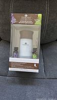 Front of sealed Essenza ultrasonic diffuser box with view of diffuser and two essential oils