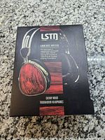 Front of retail box showing LSTN Troubadour cherry wood headphones