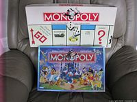 Classic and Disney Monopoly game boxes front view