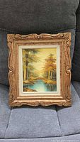 Front view of framed landscape painting