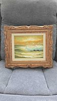 Front view of framed seascape painting