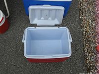 Open red chest cooler showing interior