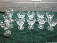 Group view of all 11 pinwheel crystal pieces: 5 goblets, 6 sherbet dishes