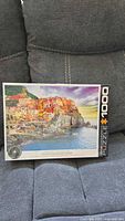 Front of sealed 1000-piece Mediterranean Oasis jigsaw puzzle box