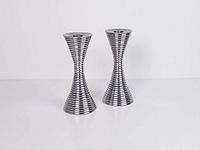 Front view of both aluminium candle holders