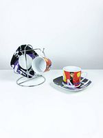 Full set on stand showing two cups and two saucers