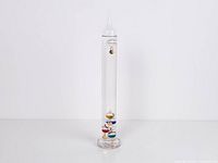 Full view of Galileo thermometer standing upright