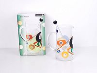 Pitcher with stirrer beside original box