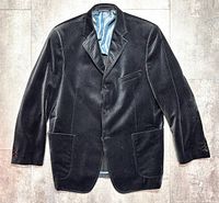 Front view of blazer showing fabric pattern, pockets and button closure