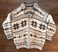 Front view of Cowichan raw wool zip sweater showing pattern, pockets and collar