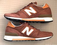 Side view of both shoes showing color, material, and outsole.