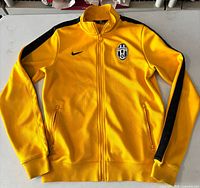 Front view of yellow Juventus Nike track jacket