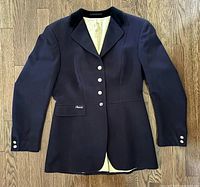 Front view of navy Pikeur riding jacket showing velvet collar, four buttons, pocket logo
