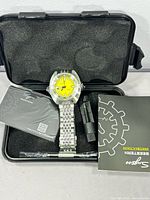 Watch and accessories inside black foam case