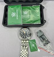 Watch with box, manuals, tag, spare links